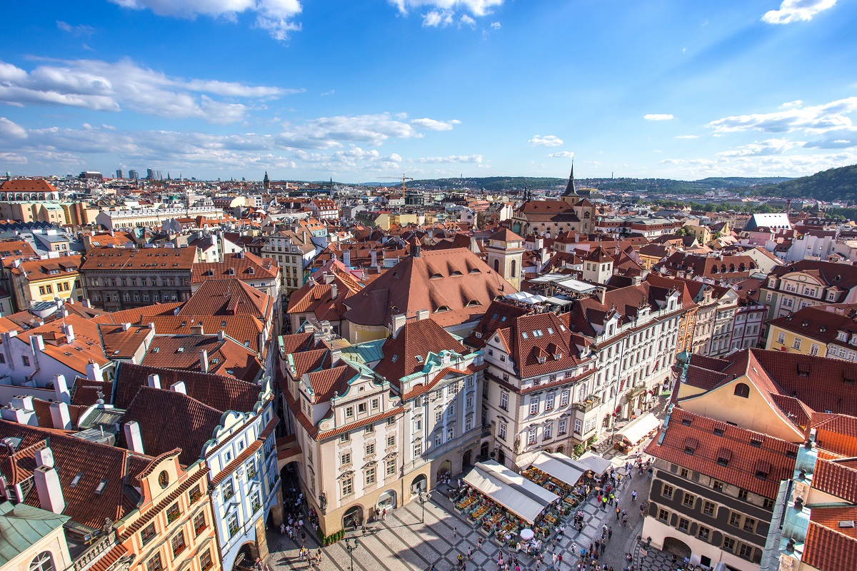 Prague old town square with old church and castle in shopping st
